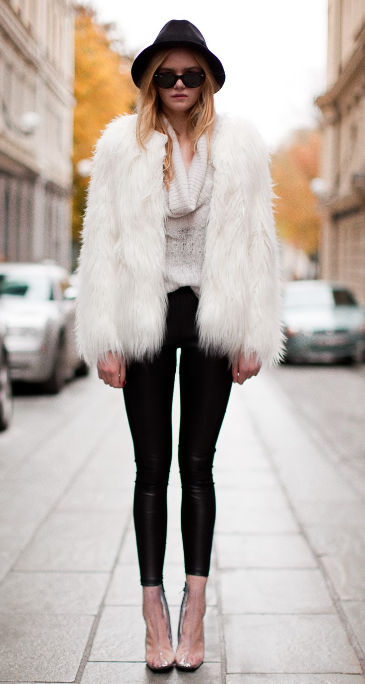 Blonde Girl wearing White Fur Coat and Black Opaque Leggings